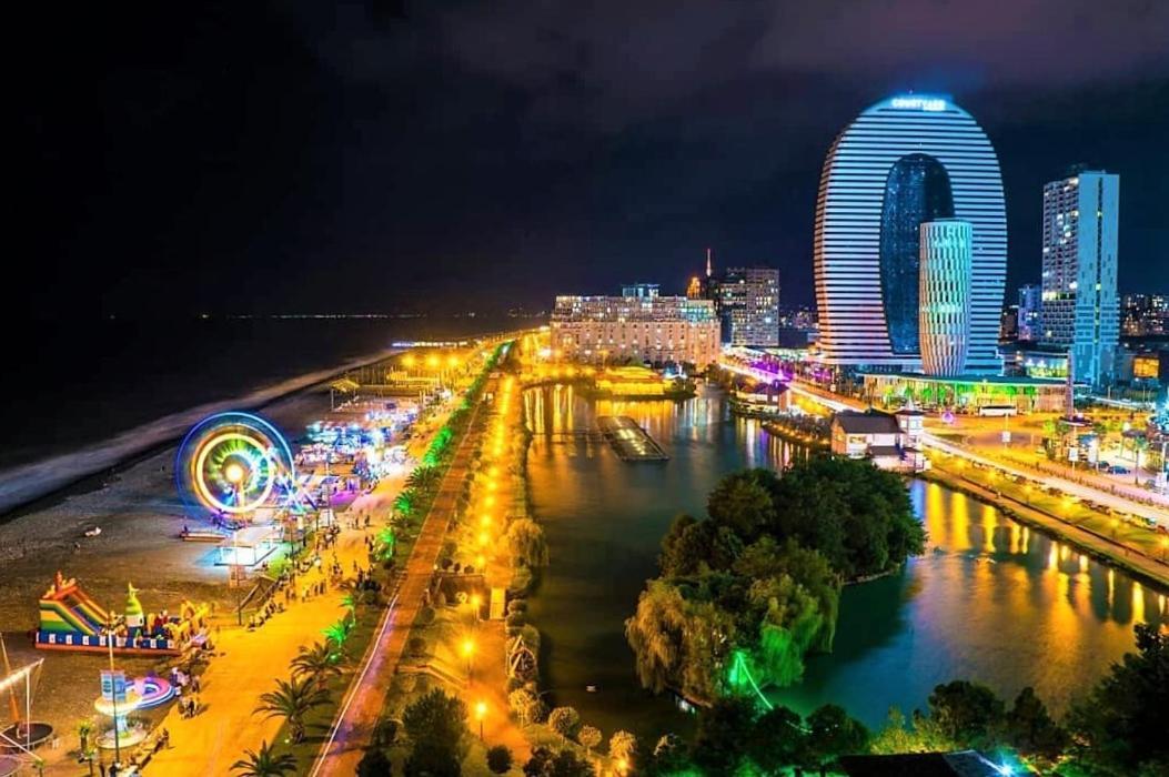 Alliance Palace Batumi Exterior photo Night view of the city